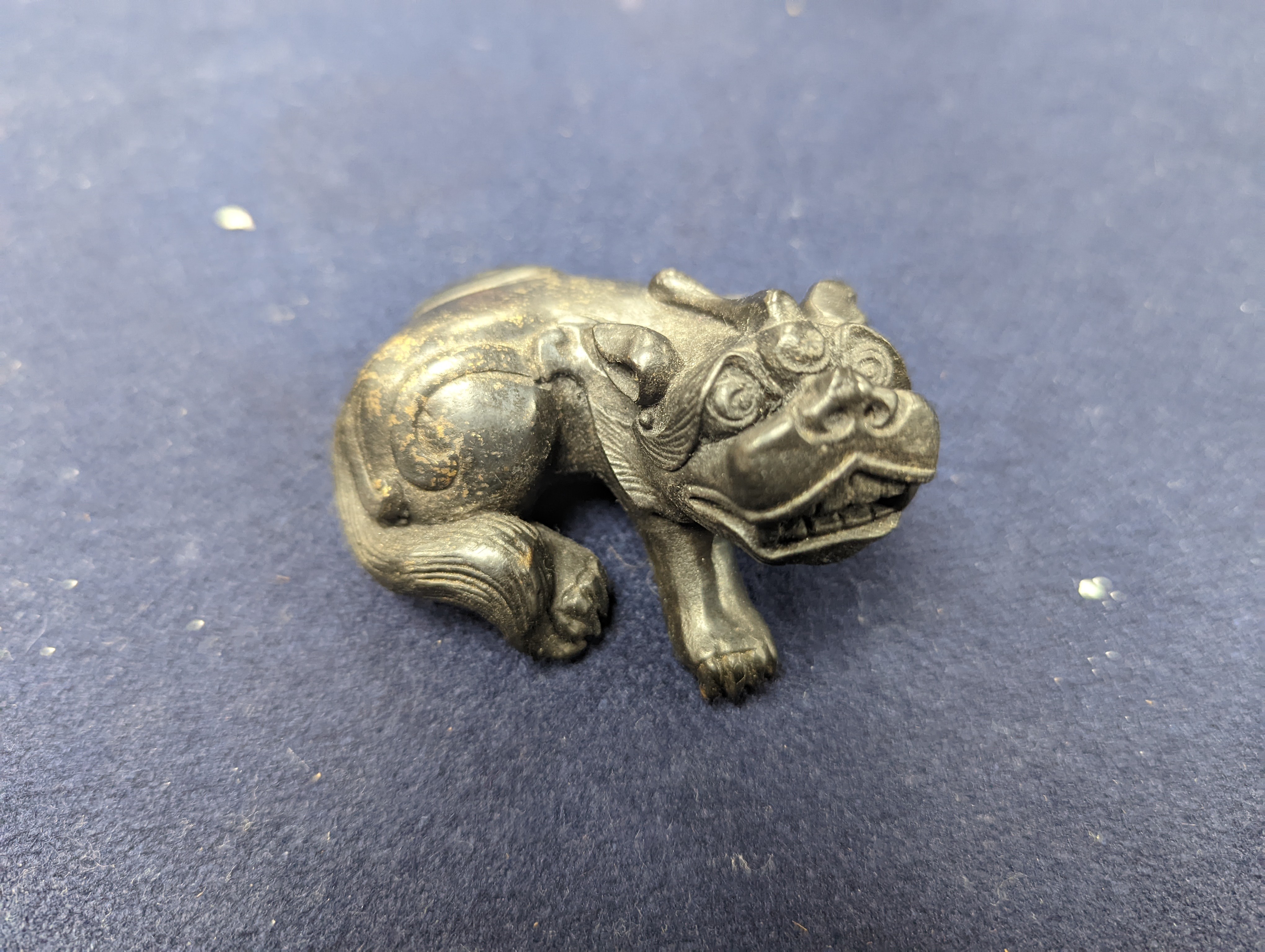 A Chinese gilt copper figure, a Chinese Dog of Fo, a bell, a censer, six Indian bronze figures and a scroll box